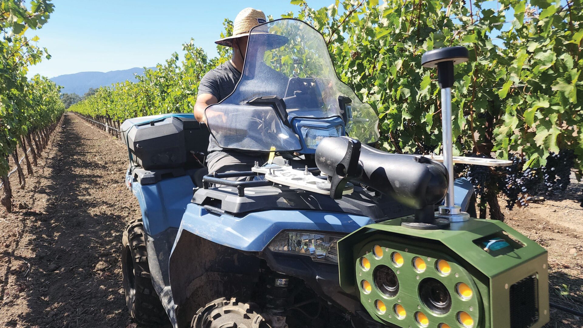A Bloomfield Robotics camera system mounted on an ATV scans an orchard canopy in California