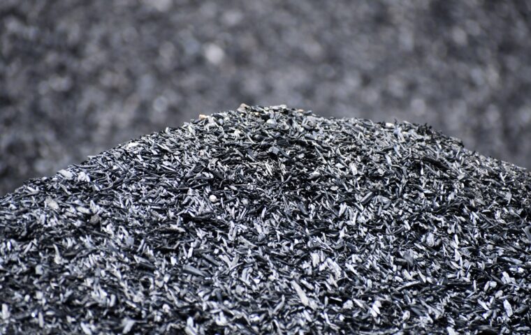 A pile of biochar made from almond shells showing the porous structure that retains water and supports microbial life